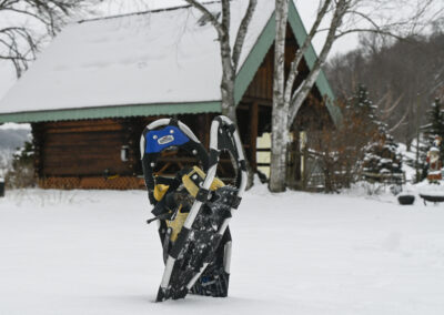 Snowshoes outside a cabin in winter