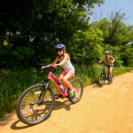 Bicyclists on the bike trail in summer