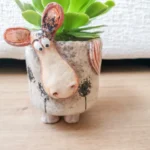 A planter shaped like a cow