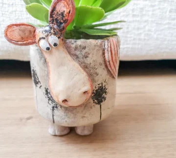 A planter shaped like a cow