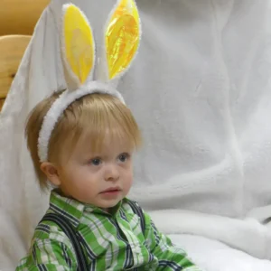 Boy wearing rabbit ears.