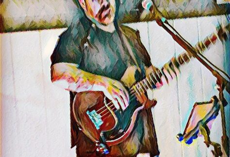 A stylized image of a man playing guitar