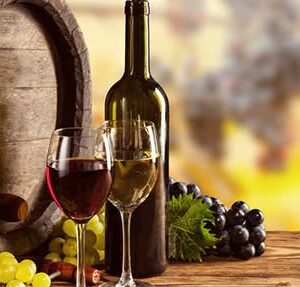 a bottle of wine and two glasses on a table.
