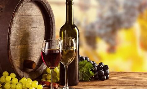 a bottle of wine and two glasses on a table.