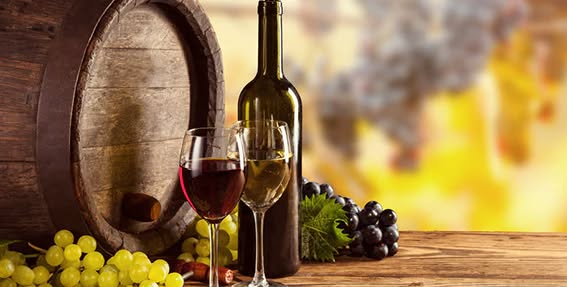 a bottle of wine and two glasses on a table.