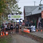 A group of runners get ready to start a race on the Elroy Sparta Bike Trail