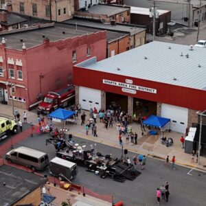 overhead photo of street blocked off with a band