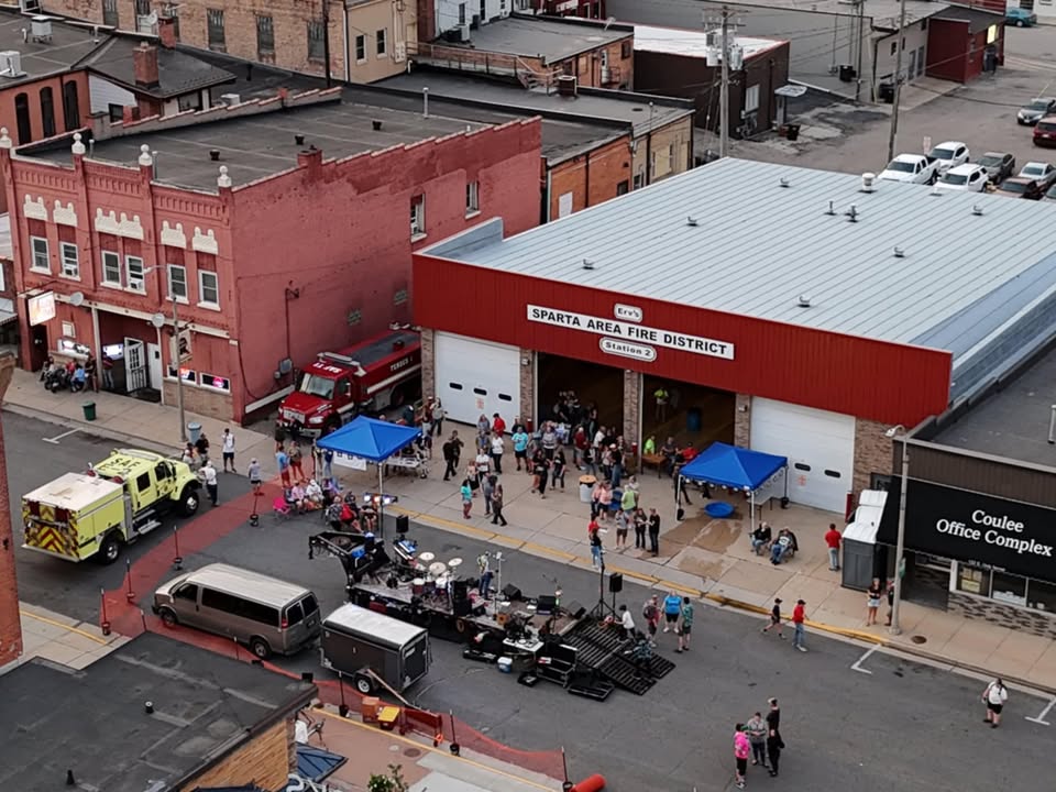 overhead photo of street blocked off with a band