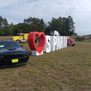 A love sparta sign next to trucks