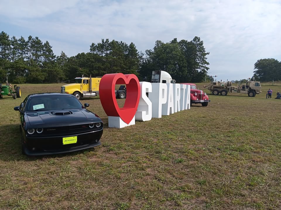 A love sparta sign next to trucks