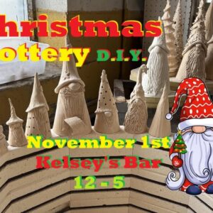 clay trees and gnomes lined up on a kiln