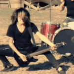 A man playing an electric guitar