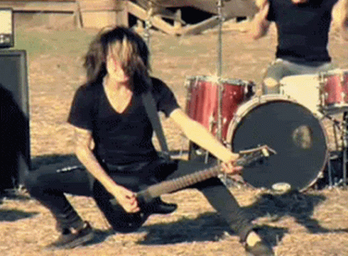 A man playing an electric guitar