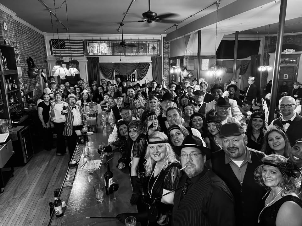 A photo of a bar full of 1950s dressed people