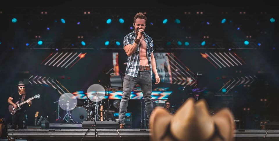 Brent Westgrove singing on stage