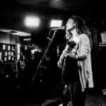 Marah with a guitar on stage