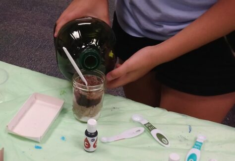 A picture of a person making a sugar scrub.