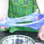 A picture of slime in a kid's hand.