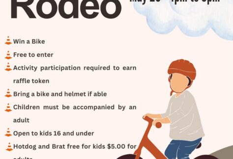 A poster with the event information on it and a child riding a bike.
