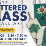 A poster with the event information also showing shattered glass wall art.