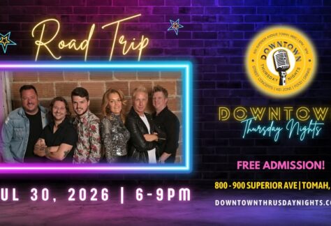 A poster with the event information on it along with a picture of the band Road Trip on it.