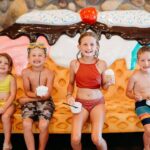 children sitting on A waffle corn shape seat.