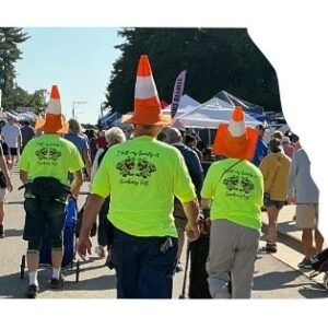A photo of people with traffic corns on their heads.