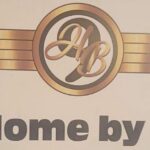 Home by 9 logo