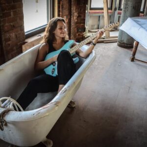 Musican Payton Eilers with her guitar