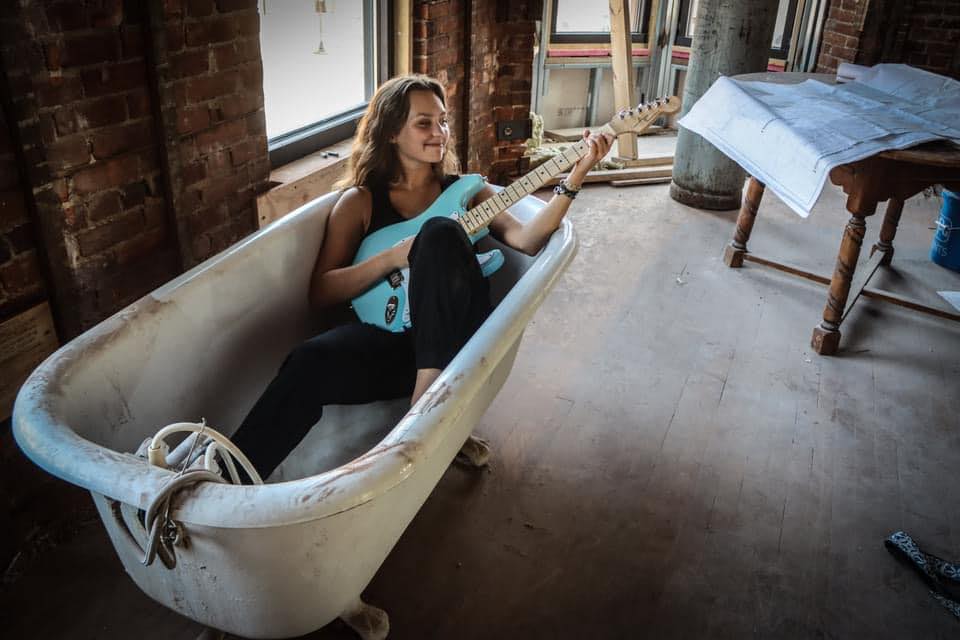 Musican Payton Eilers with her guitar