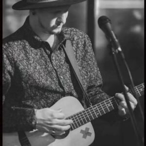 Duncan Peterson playing the guitar