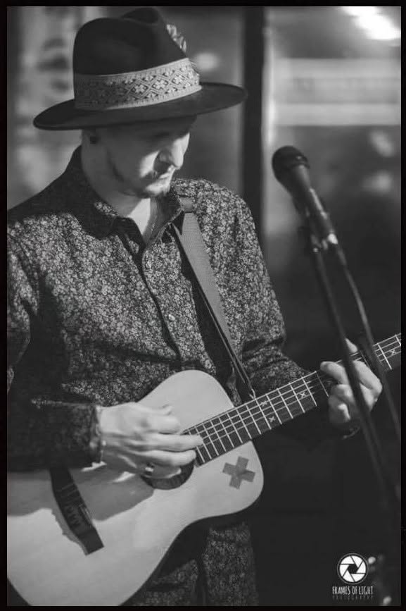 Duncan Peterson playing the guitar