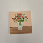 a canvas painting of a vase full of roses