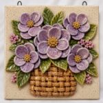 A ceramic tile with a floral basket motif