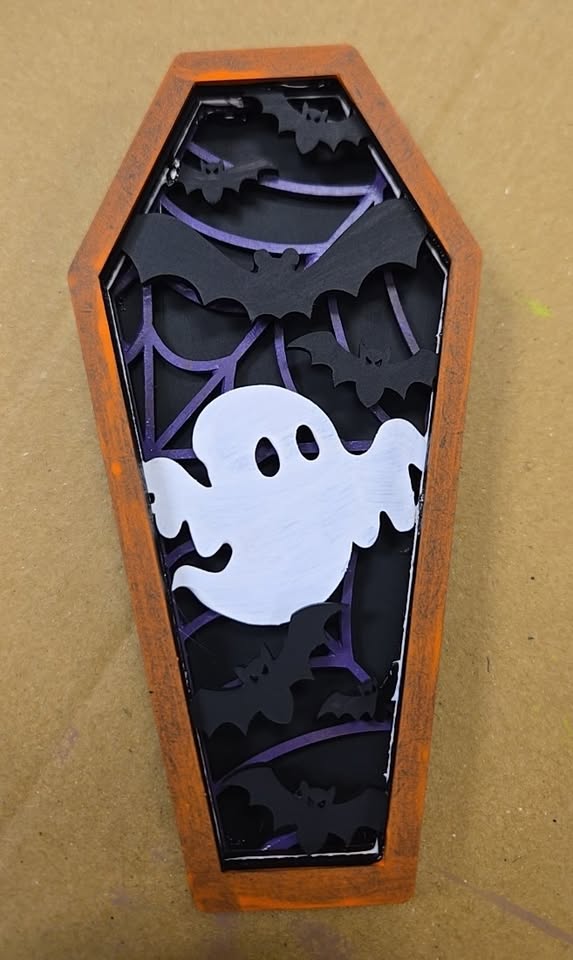 a ghost coffin made with layered wood
