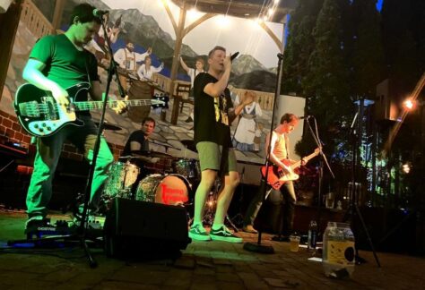 The band Through Crimson performing on stage