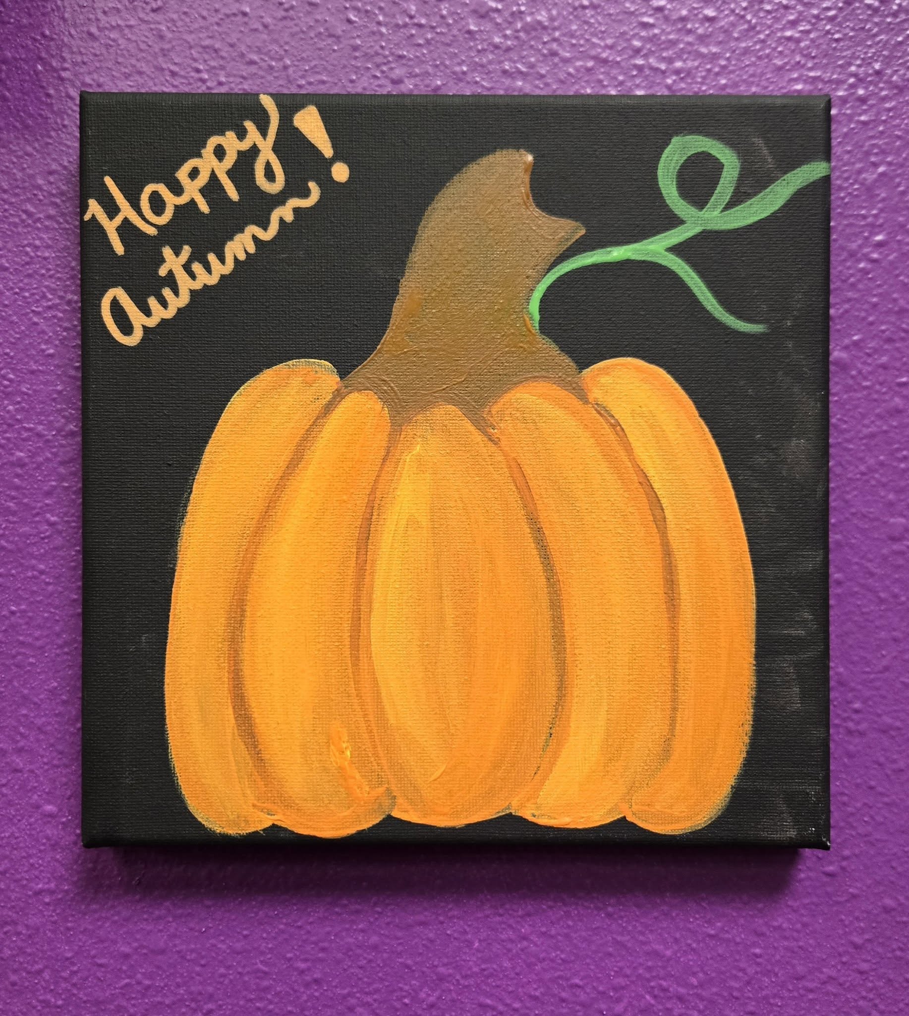 a canvas painting of a simple pumpkin