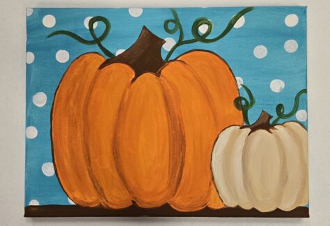 A canvas painting of a pumpkin