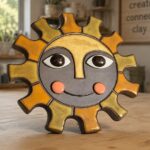 A pottery sun wall hanger