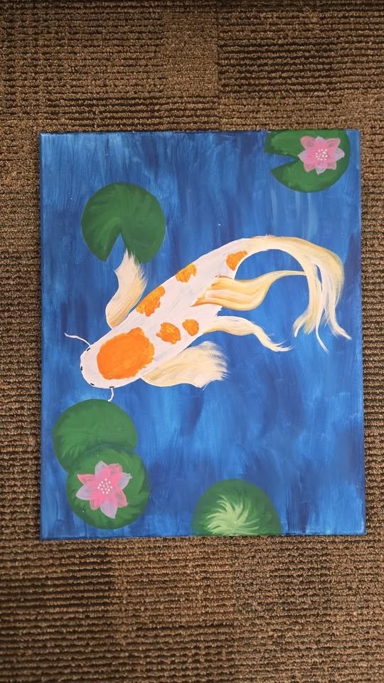 A canvas painting of a koi fish