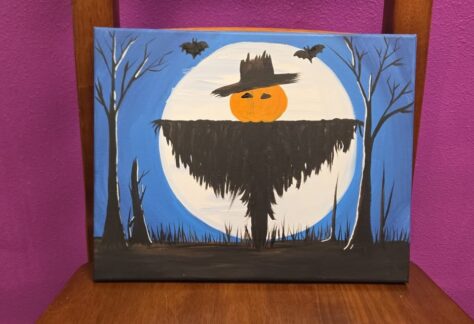 A canvas painting of a scarecrow in front of the full moon